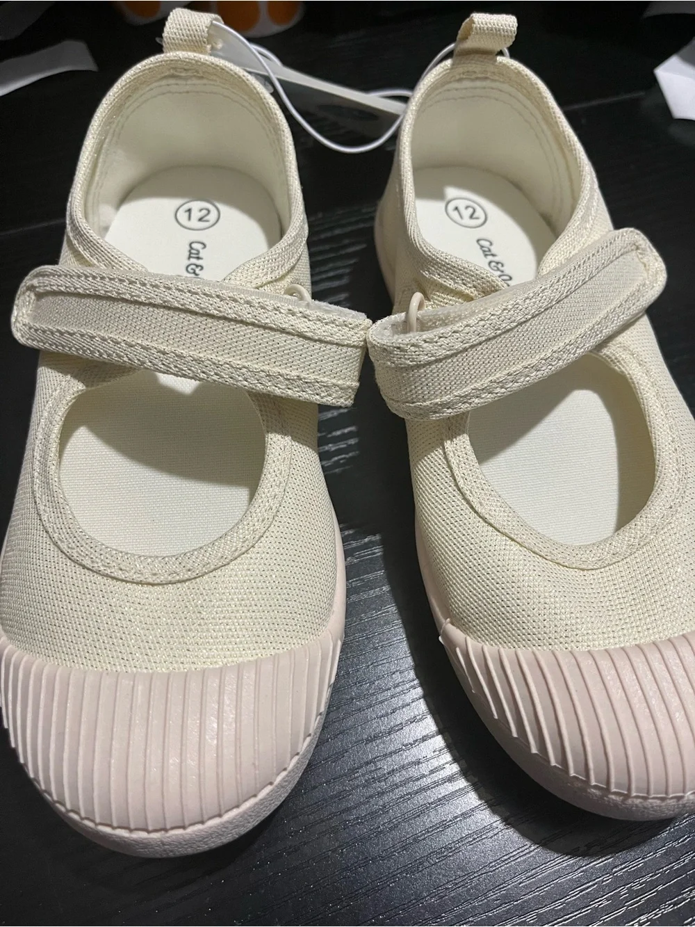 Cat & Jack Toddler Glitter Mary Jane Flats in an ivory/champagne shimmer finish.